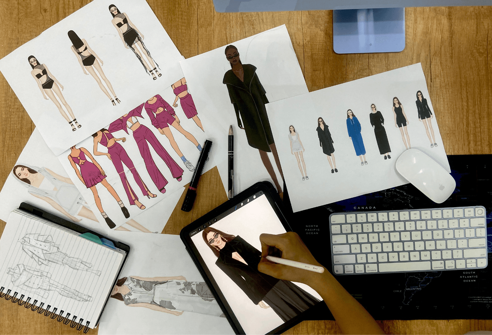 Fashion design concept and illustration process - designer's workspace with sketches and digital tools