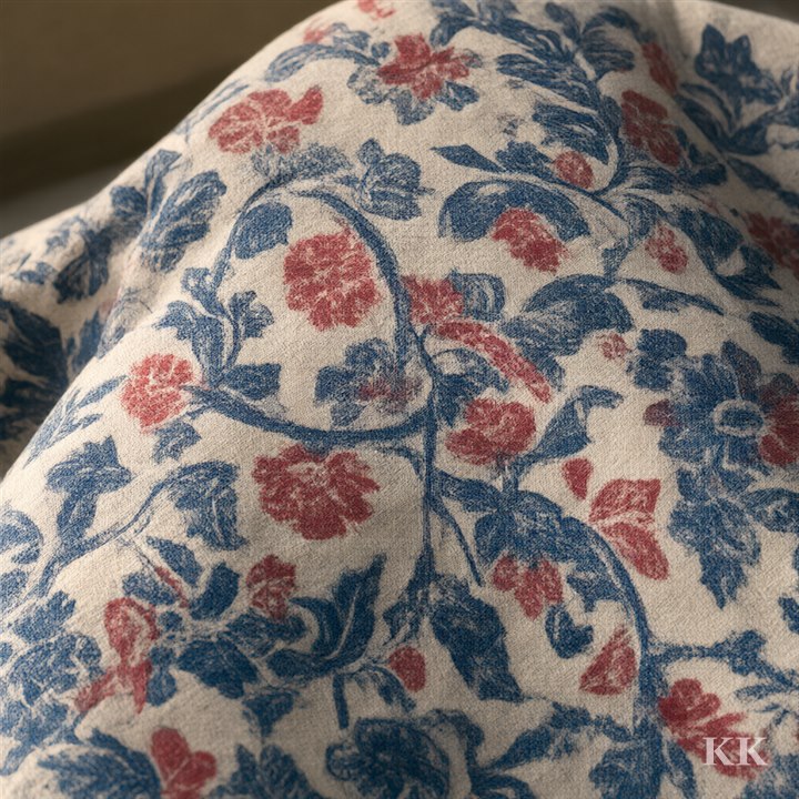 Hand block-printed cotton in indigo and madder red with faint overlaps where each wooden block was set down. No text.